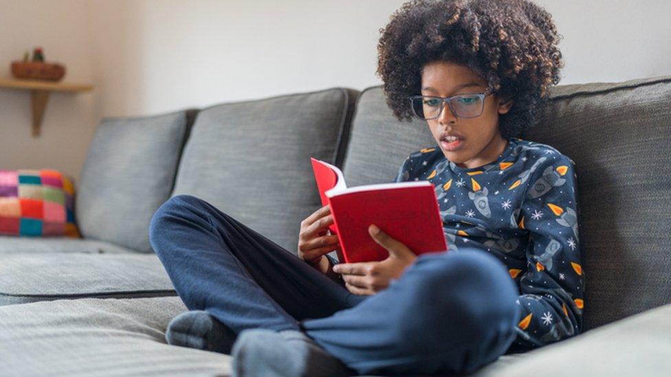 Boy reading book