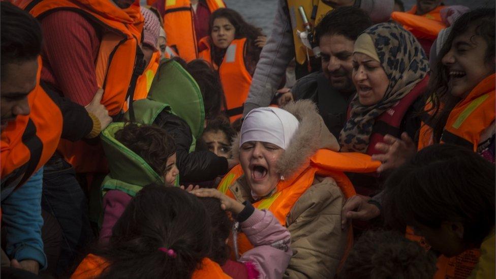 Migrants arrive on the Greek island of Lesbos on 24 November 2015