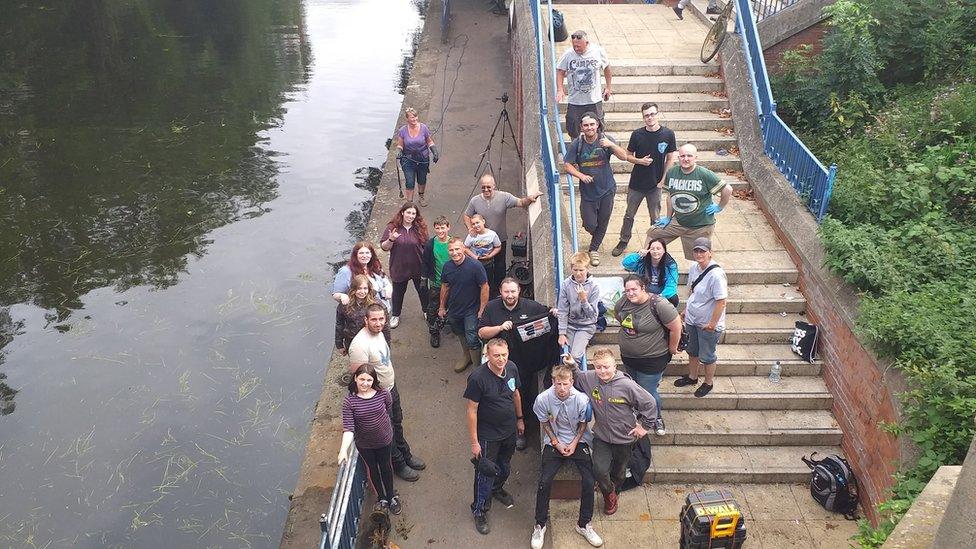 Team of magnet fishers by the River Soar