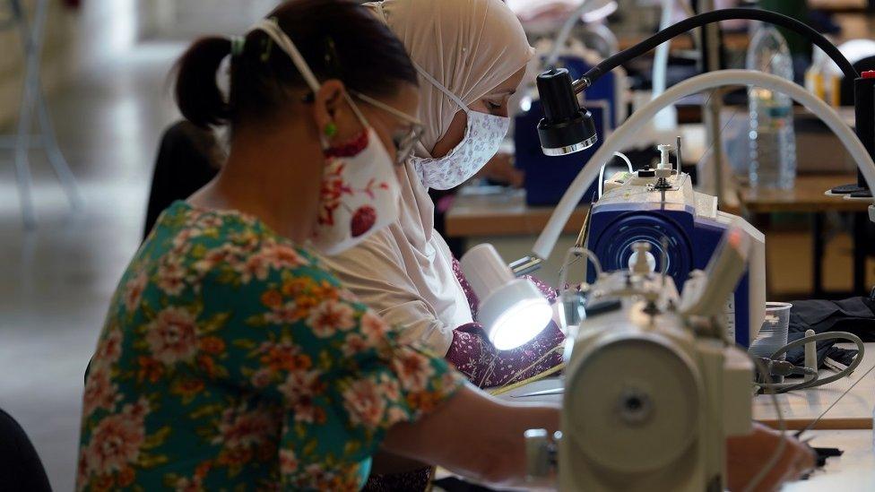 Workers inside a face masks factory in Roubaix, near Lille, as part of the visit of French Prime Minister Jean Castex on 3 August 2020 in Lille, France.