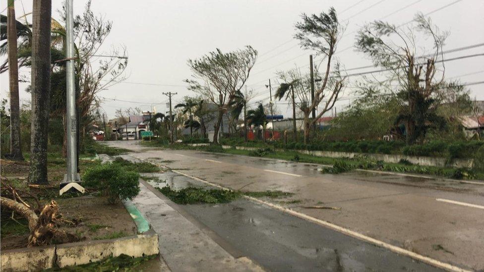 Storm damage and flooded road in Tuguegarao