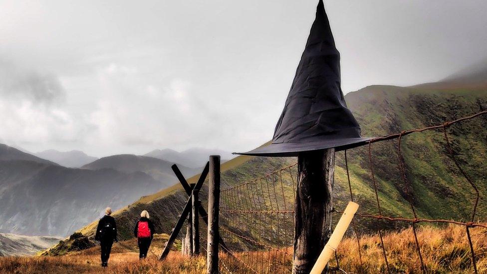 A witches hat on a fence post in Snowdonia