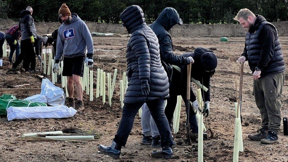 A group of volunteers taking part in a Creating Nature's Corridors rewilding project