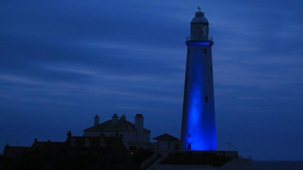 St Mary's lighthouse in Whitley Bay on the North East coast is illuminated blue in recognition and support of NHS workers and carers fighting the coronavirus pandemic