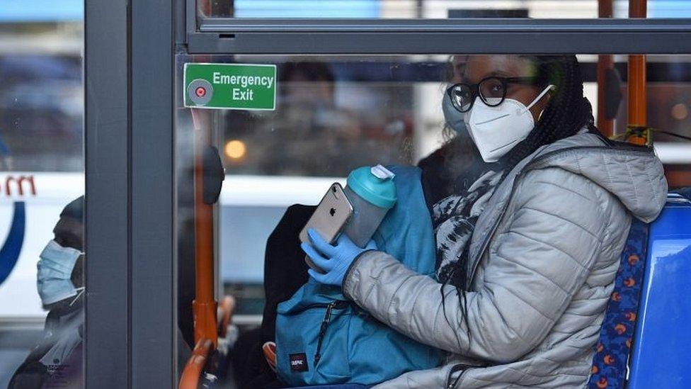 Mask wearer on bus