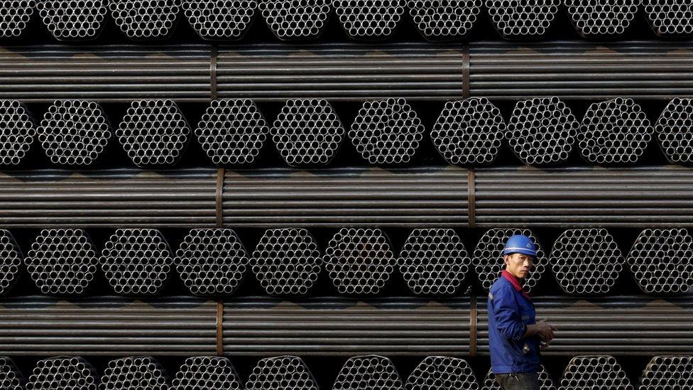 A worker at a steel pipe plant in Tangshan, China