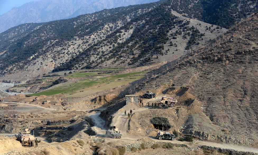 Afghan security personnel patrol during an ongoing anti-Taliban operation in Dangam district near the Pakistan-Afghanistan border in the eastern Kunar province.