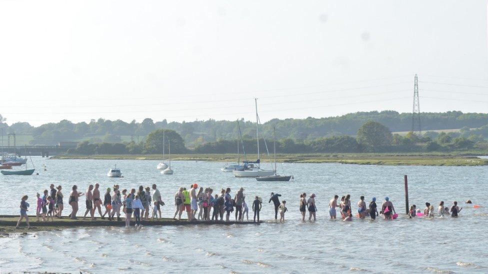 people on the slipway