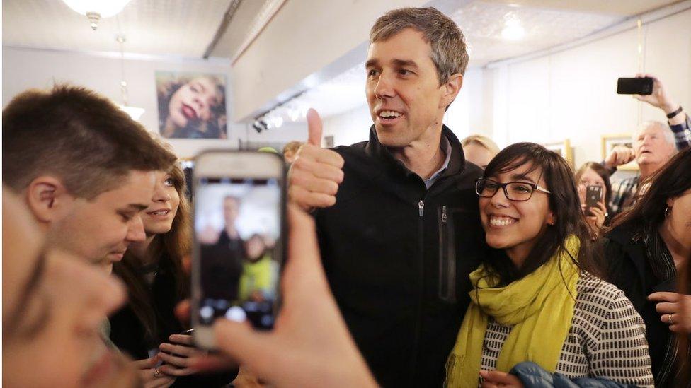 Democratic presidential candidate Beto O'Rourke poses for photographs with supporters during his second day of campaigning