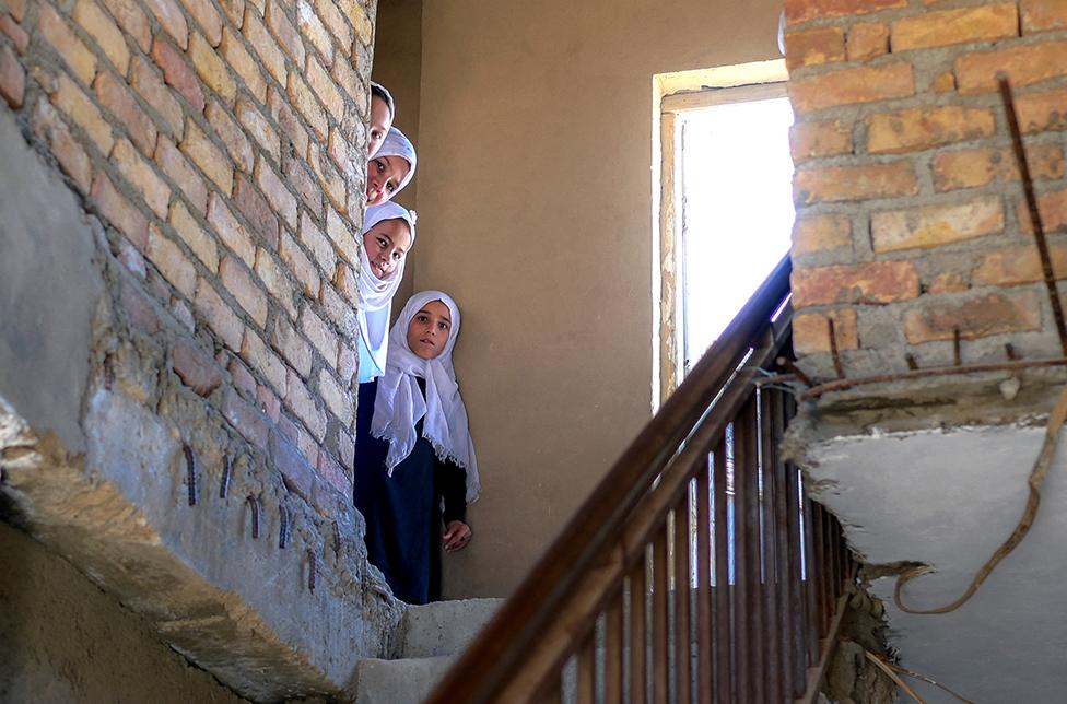 Schoolgirls arrive at a gender-segregated school in Kabul, Afghanistan.