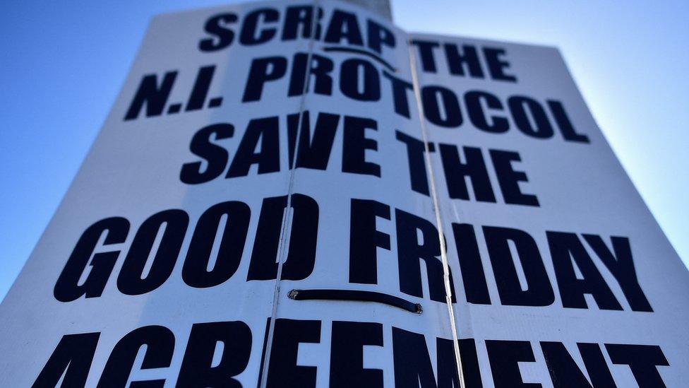 A poster reading: "Scrap the NI Protocol, Save the Good Friday Agreement" at the port of Larne in Northern Ireland