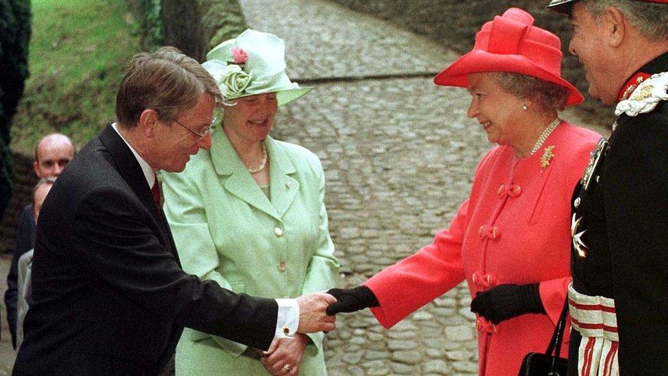 First Secretary of the Assembly at the time, Alun Michael (L), accompanied by his wife Mary greets The Queen and the Lord Lieutenant of South Glamorgan Norman Lloyd Edwards at Llandaff Cathedral in Cardiff, Wales, 26 May 1999. The Queen is in Cardiff to open the National Assembly of Wales at Crickhowell House this afternoon.