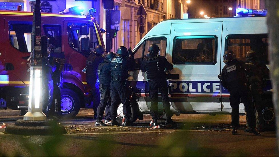 Police officers outside the Bataclan concert venue in Paris, amid reports of hostage-taking