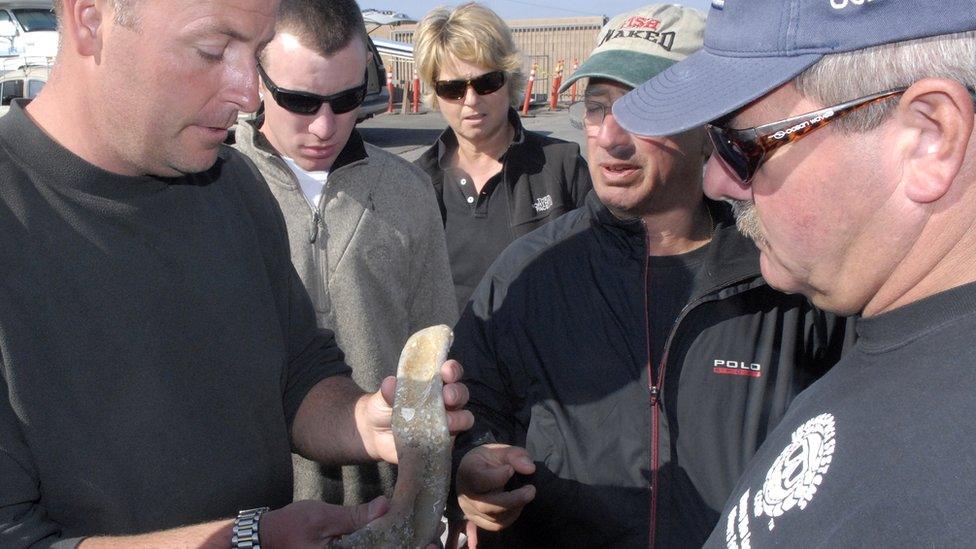 The team inspecting an item found during the last missing WASP search