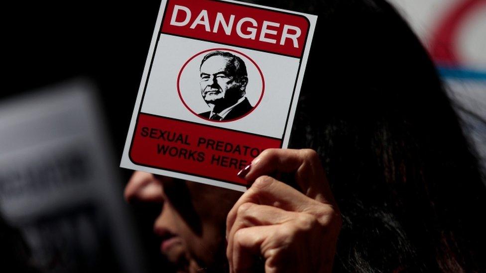 A protestor outside the Fox office in New York