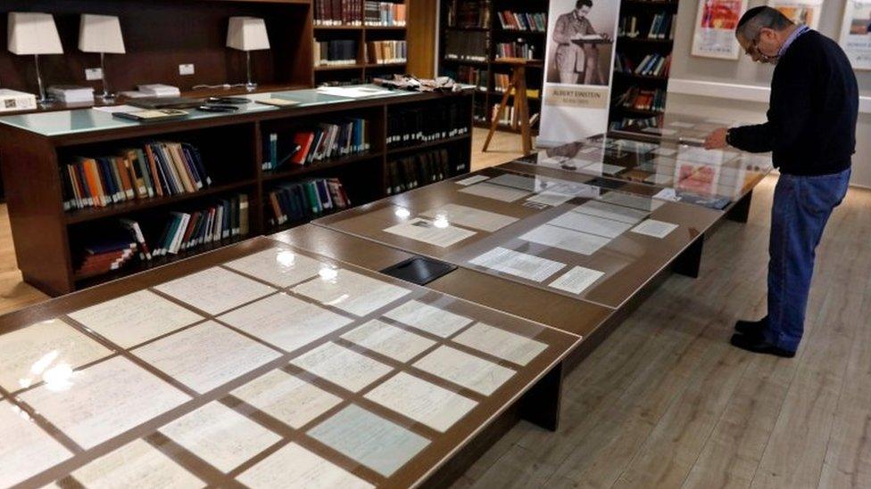 Manuscripts on display inside an exhibition at the Hebrew University of Jerusalem