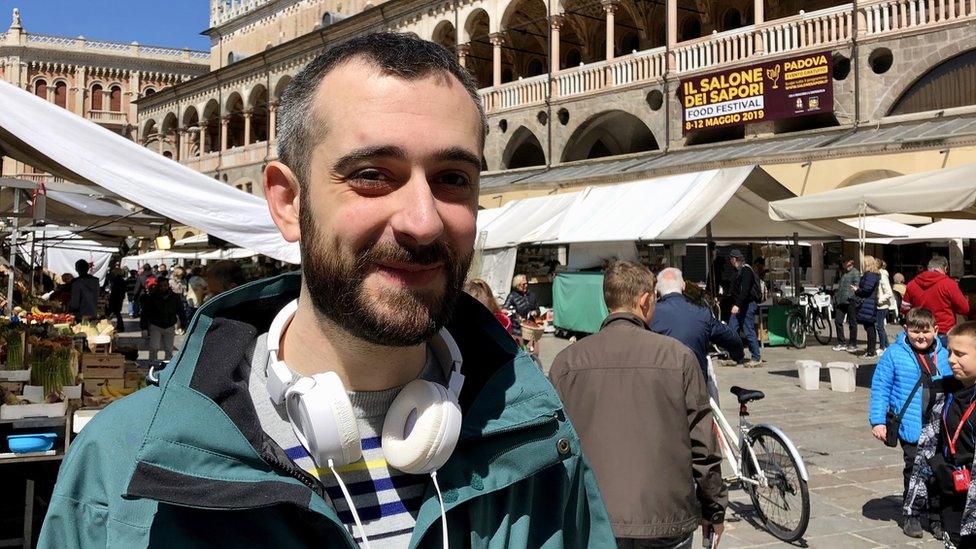 Giovanni is pictured in a bustling market Padua