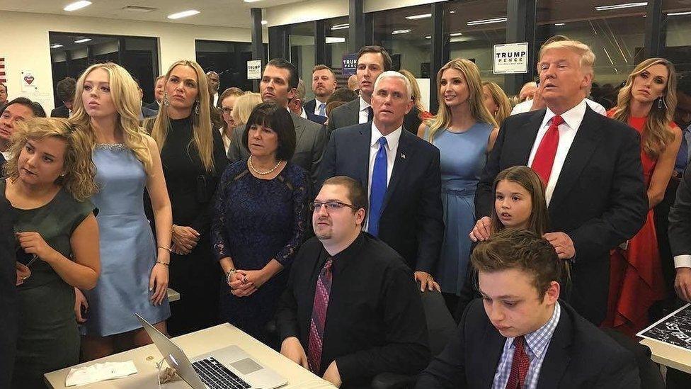 US presidential candidate Donald Trump (standing, right) watches election results with family and supporters.