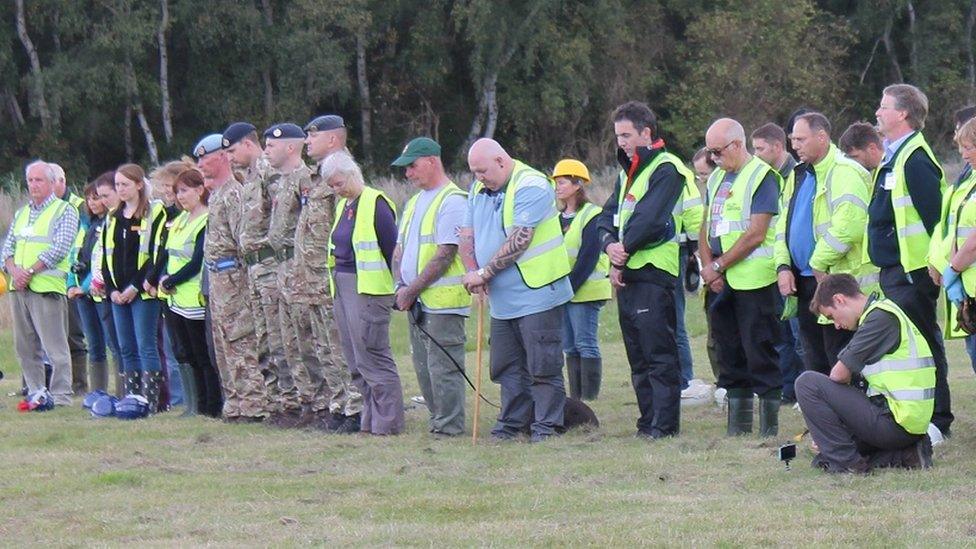 People observing a one minute's silence