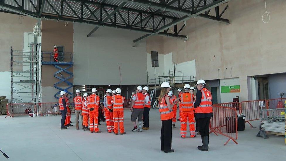 Contractors inside the new entrance hall