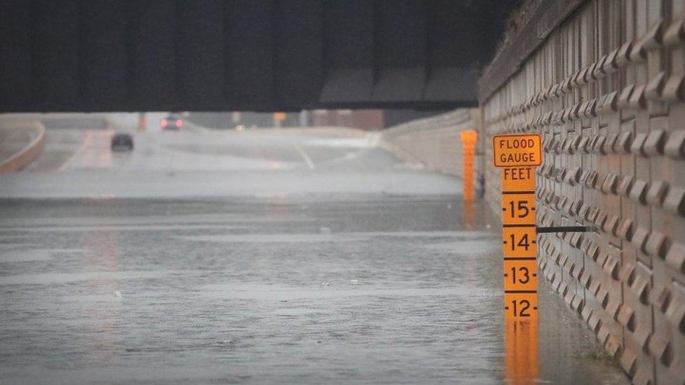 A gauge shows the depth of water in an underpass on Interstate 10 which has been inundated with flooding from Hurricane Harvey (27 August 2017)