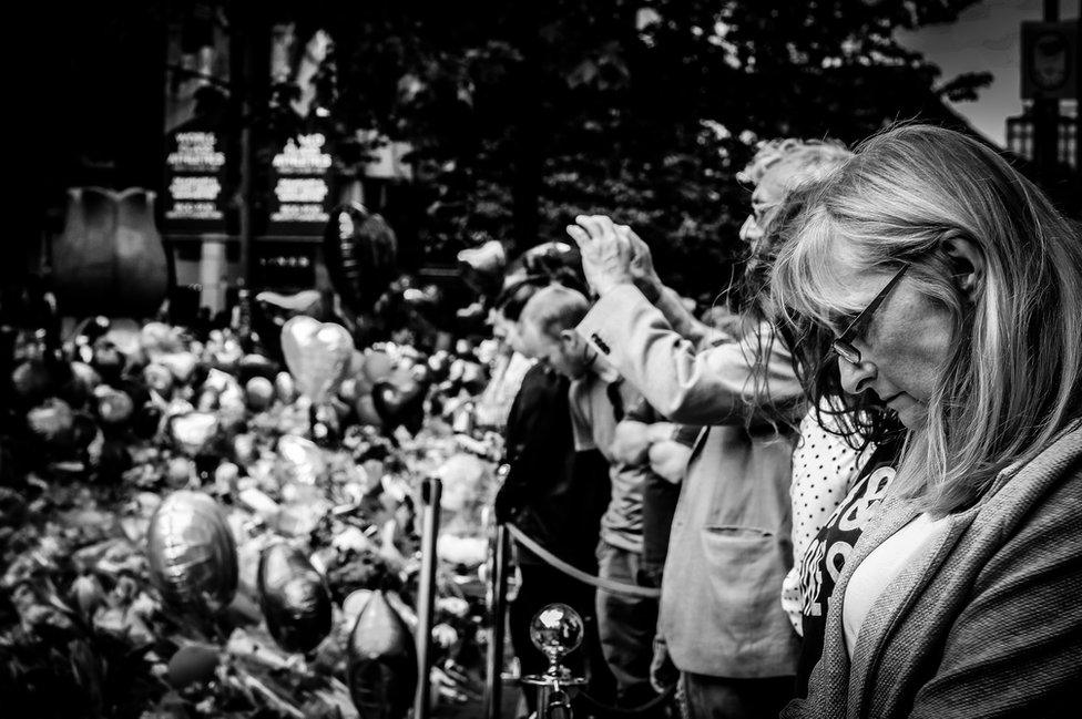 People gather at St Anne's Square in Manchester