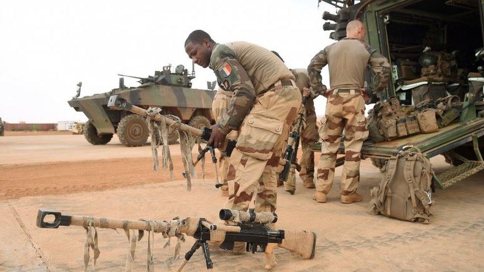 A French soldier gets ready prior to the visit of French President to the troops of France"s Barkhane counter-terrorism operation in Africa"s Sahel region in Gao, northern Mali, 19 May 2017.