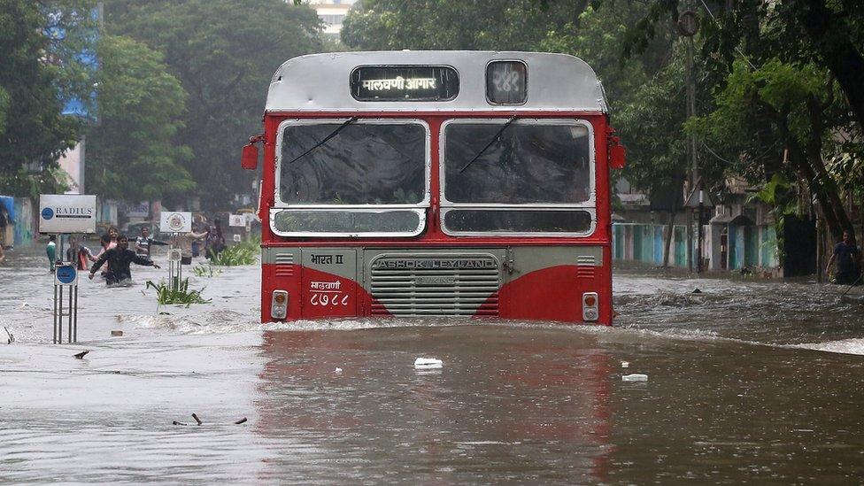 A bus tried to make it down a road in flooded Mumbai, 29 August 2017