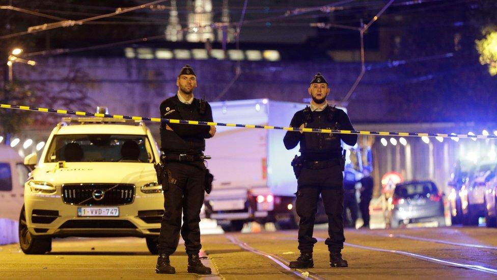 Police officers at the scene of the attack