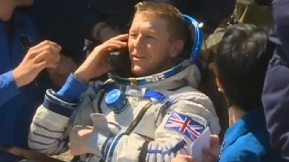 Tim Peake on the phone after landing