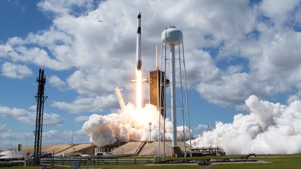 A NASA handout photo of a SpaceX Falcon 9 rocket carrying astronauts to the International Space Station