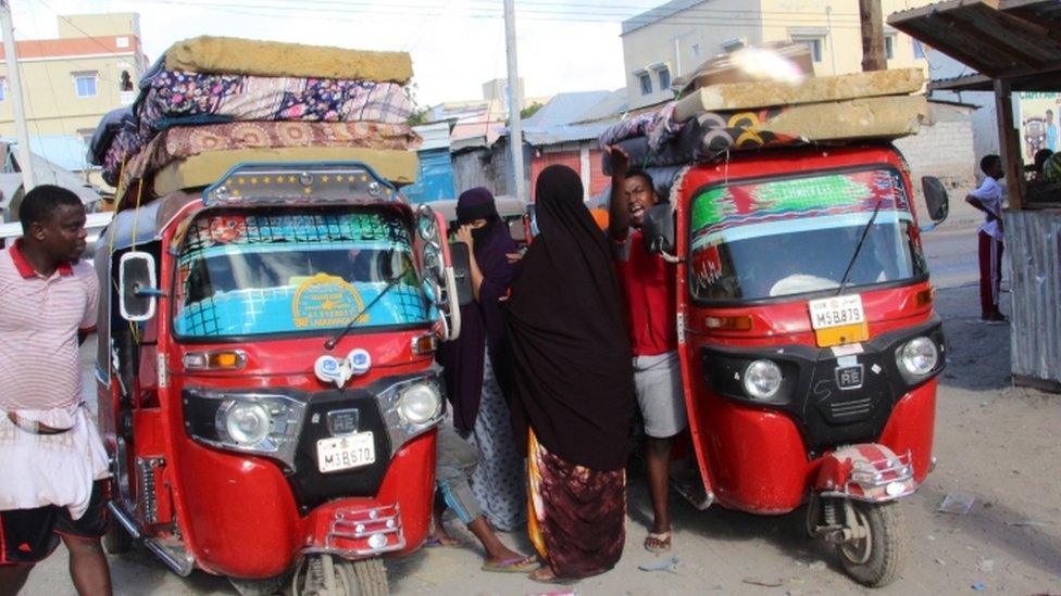 Somalis in Mogadishu packing their possession on to rickshaw bikes to flee - 27 April 2021