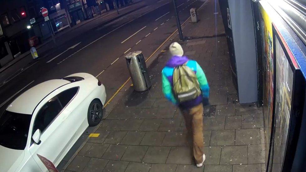 CCTV of the man, who is described as having light brown hair and was wearing light brown trousers and a blue, green and purple jacket.