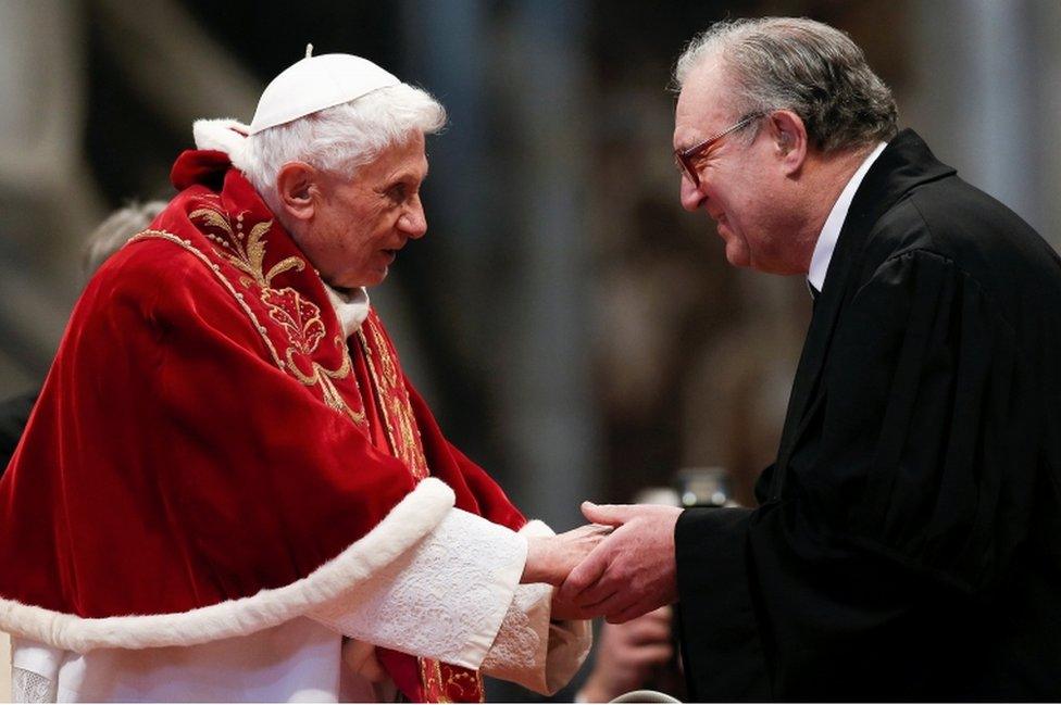 Pope Benedict XVI is greeted by Matthew Festing, Grand Master of the Sovereign Order of Malta, during a mass at the Vatican on February 9, 2013.