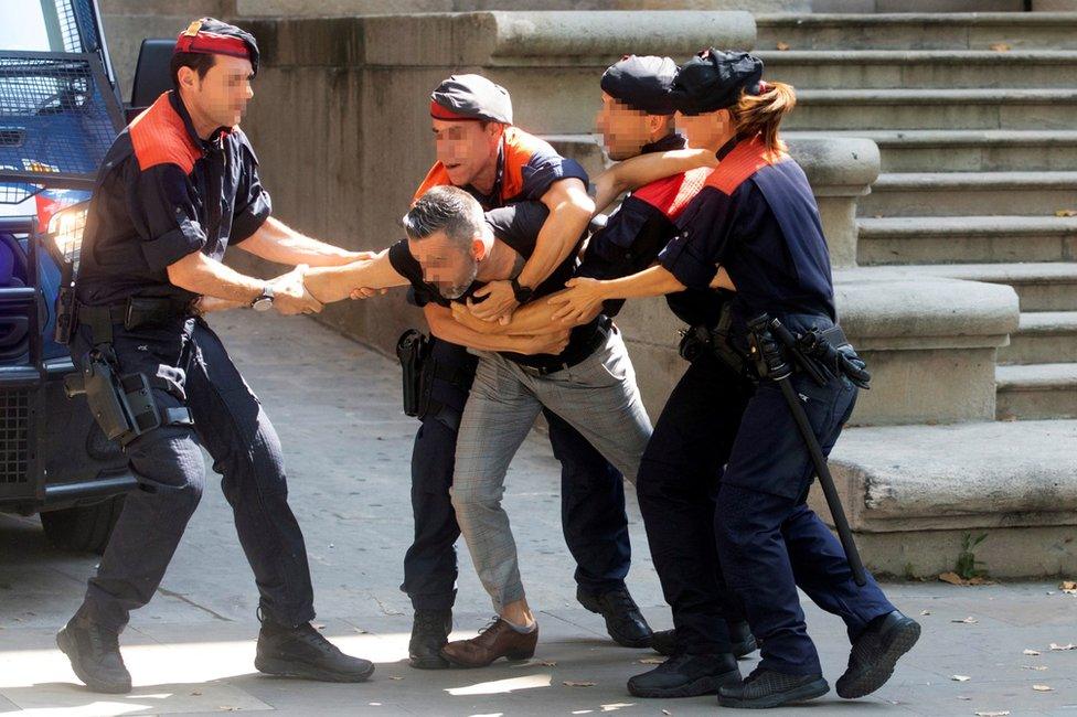 Police restrain the girl's uncle in Barcelona, 3 July