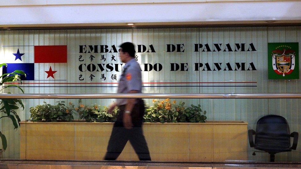 A policeman guards Panama's embassy and consulate in Taipei, Taiwan, 13 June 2017