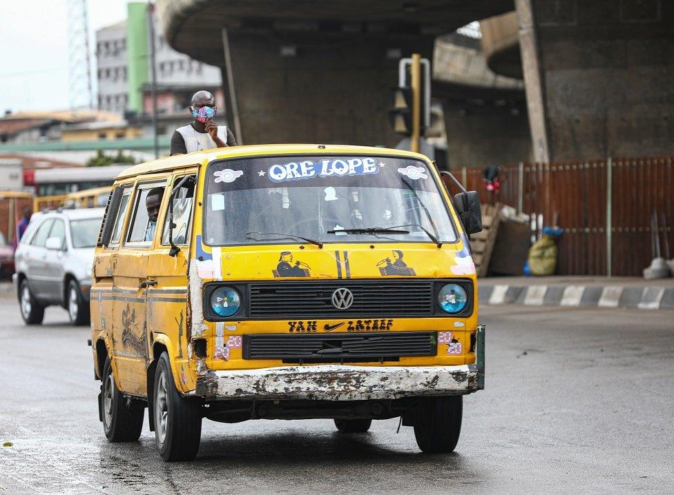 A yellow minibus taxi