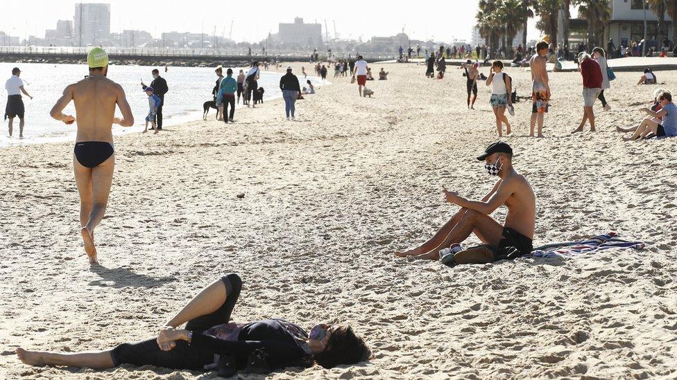 Beachgoers wear masks during lockdown in Melbourne on 6 September 2020