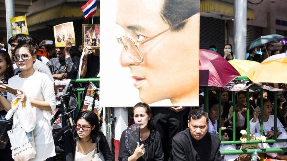 Crowds gather for the Thai king's funeral procession