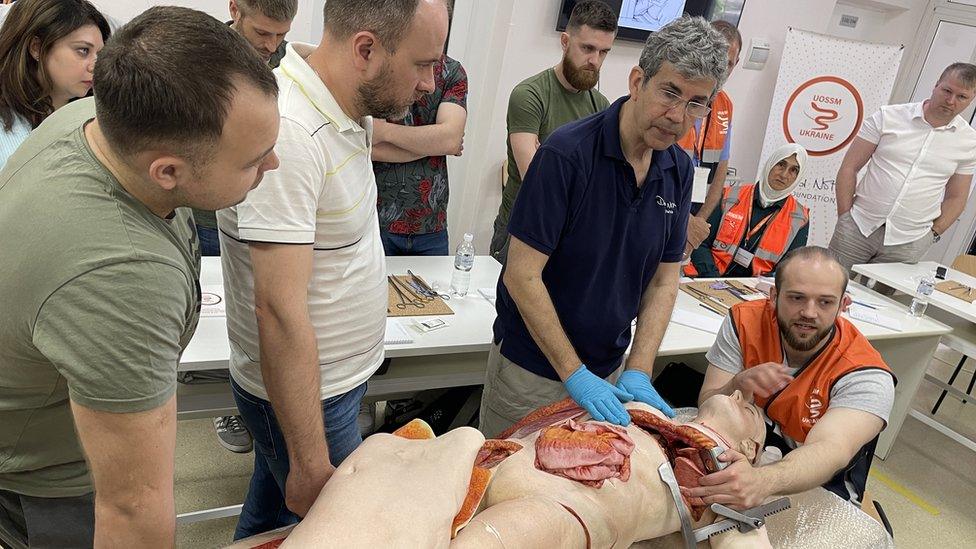 David Nott demonstrates surgical techniques on Heston, the medical dummy.