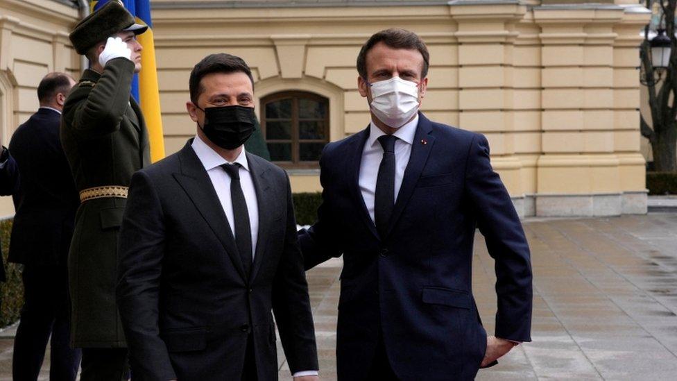 Ukrainian President Volodymyr Zelensky welcomes French President Emmanuel Macron before their talks in Kyiv, Ukraine February 8, 2022