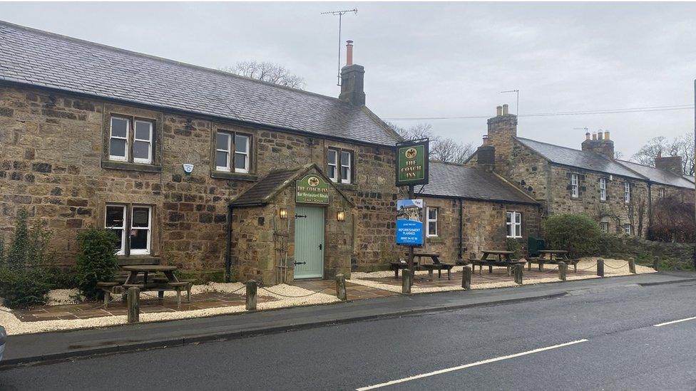 The outside of the Coach Inn showing a refurbishment sign