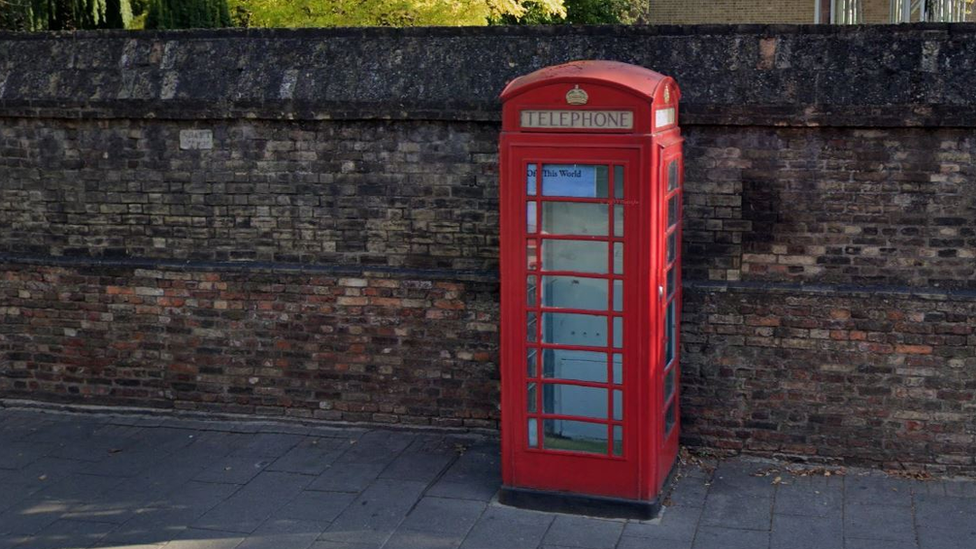 Red telephone box on St Andrews Street in Cambridge