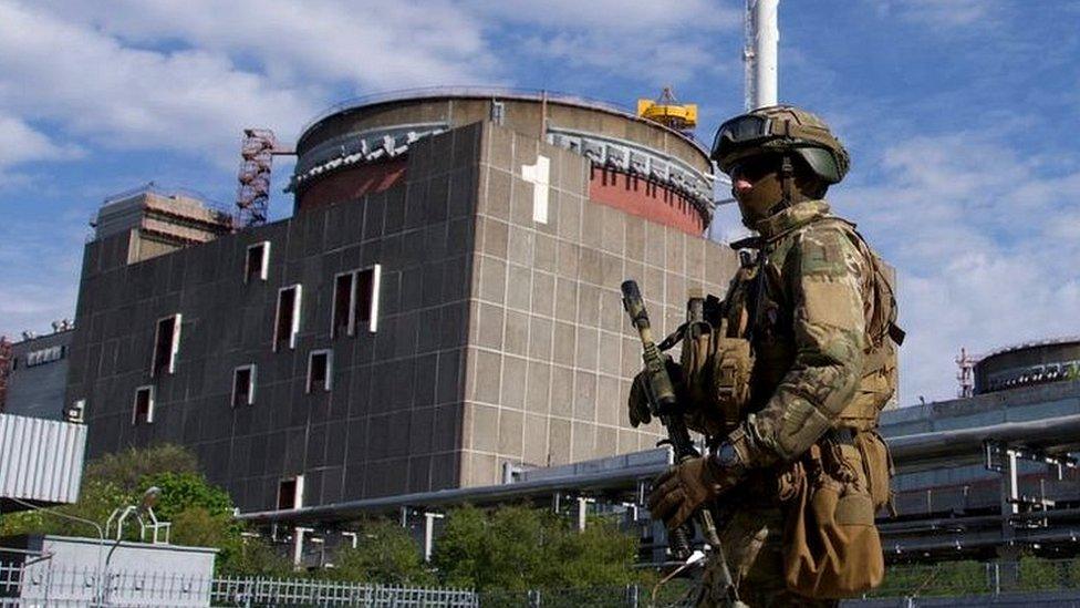 A Russian soldier patrols the territory of the Zaporizhzhia nuclear power plant on 1 May