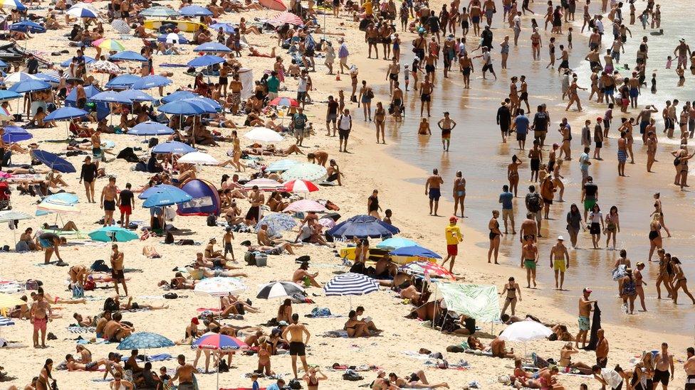 People basking in the sun at Sydney's Bondi Beach on a hot summer day in Australia, 7 January 2018