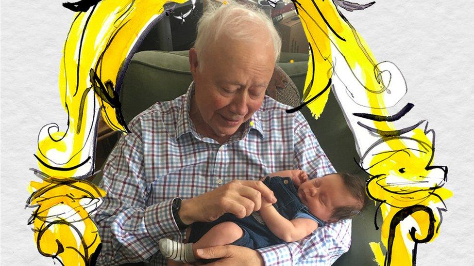 John Marriott cuddling his first grandson, Ollie