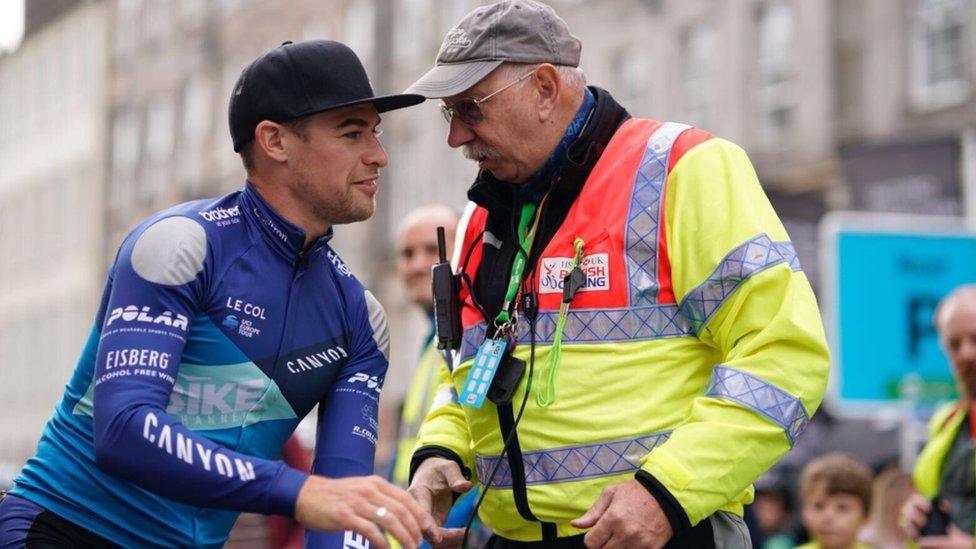 Marshall talking to a cyclist