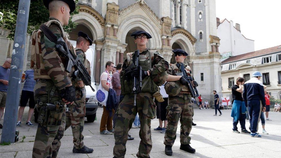 French soldiers patrol on the streets of Saint-Etienne