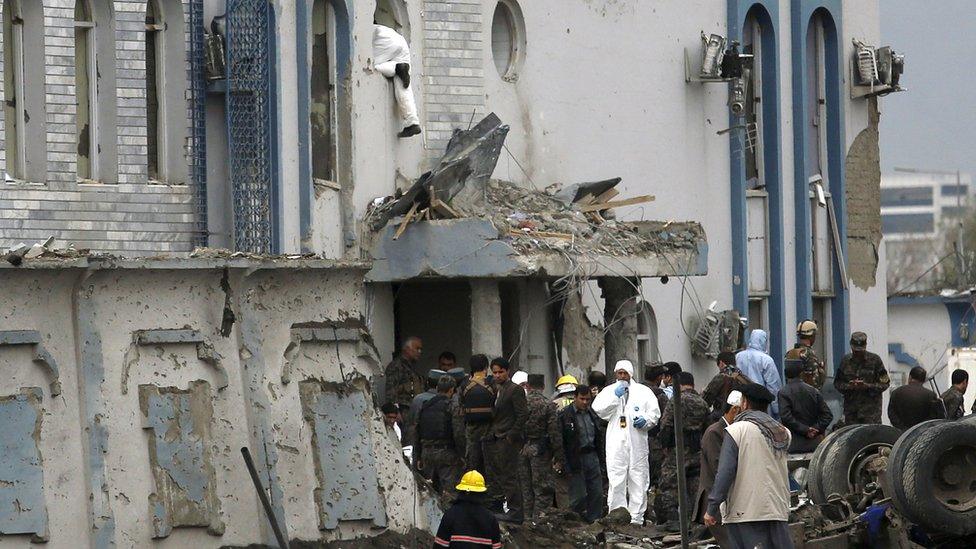 A forensic expert at the scene of a suicide attack in Afghanistan