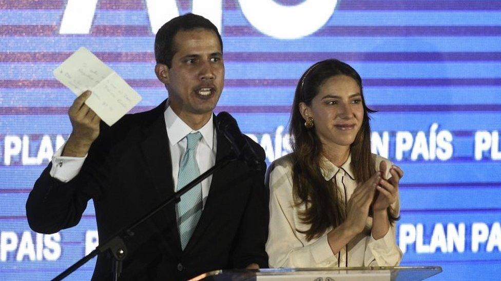 Opposition leader Juan Guaido (L) speaks next to his wife Fabiana Rosale at the auditorium of Venezuela's Central University (UCV) in Caracas on January 31, 2019.